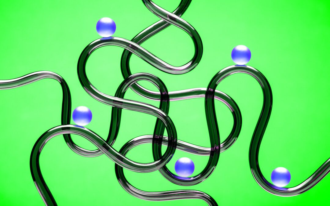 5 blue balls riding on 5 randomly arranged curved black tubes against a bright green backdrop