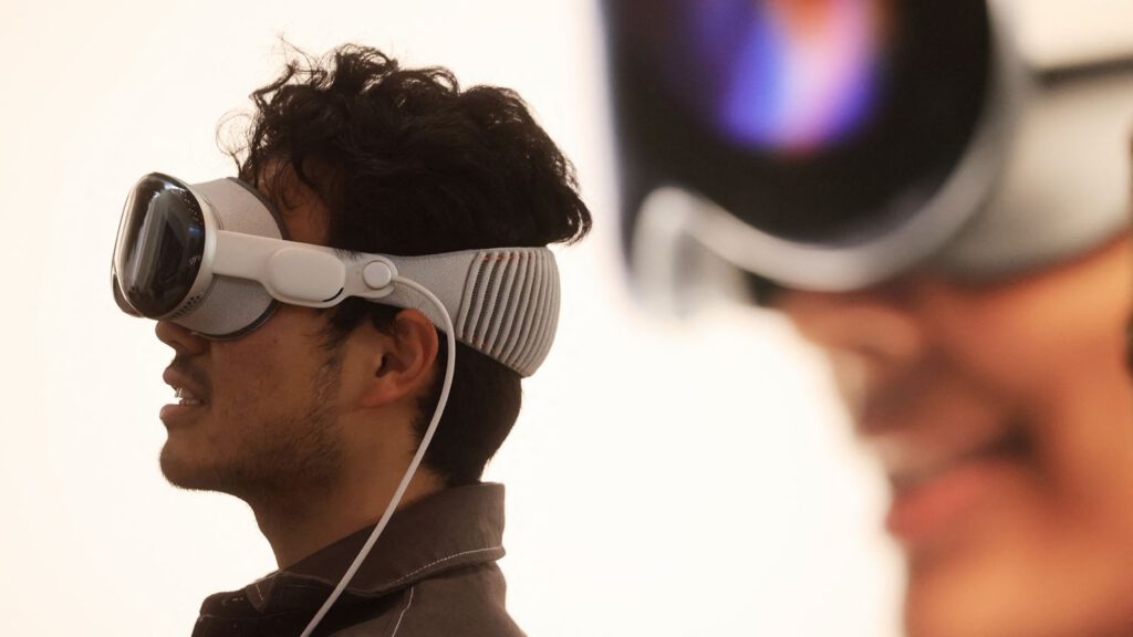 A customer tries his Vision Pro at the launch of the Apple Vision Pro at Apple The Grove in Los Angeles, California, on February 2, 2024.