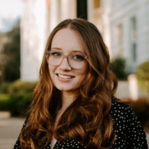 Headshot of author Rayna Perry